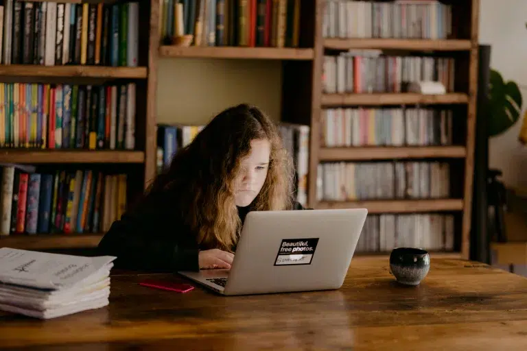 girl studying on a laptop