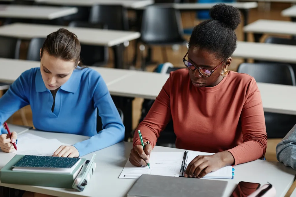 Students Taking Exam in School Closeup