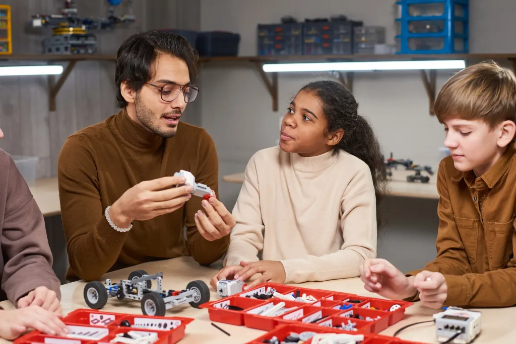 Teacher teaching children using scaffolding technique